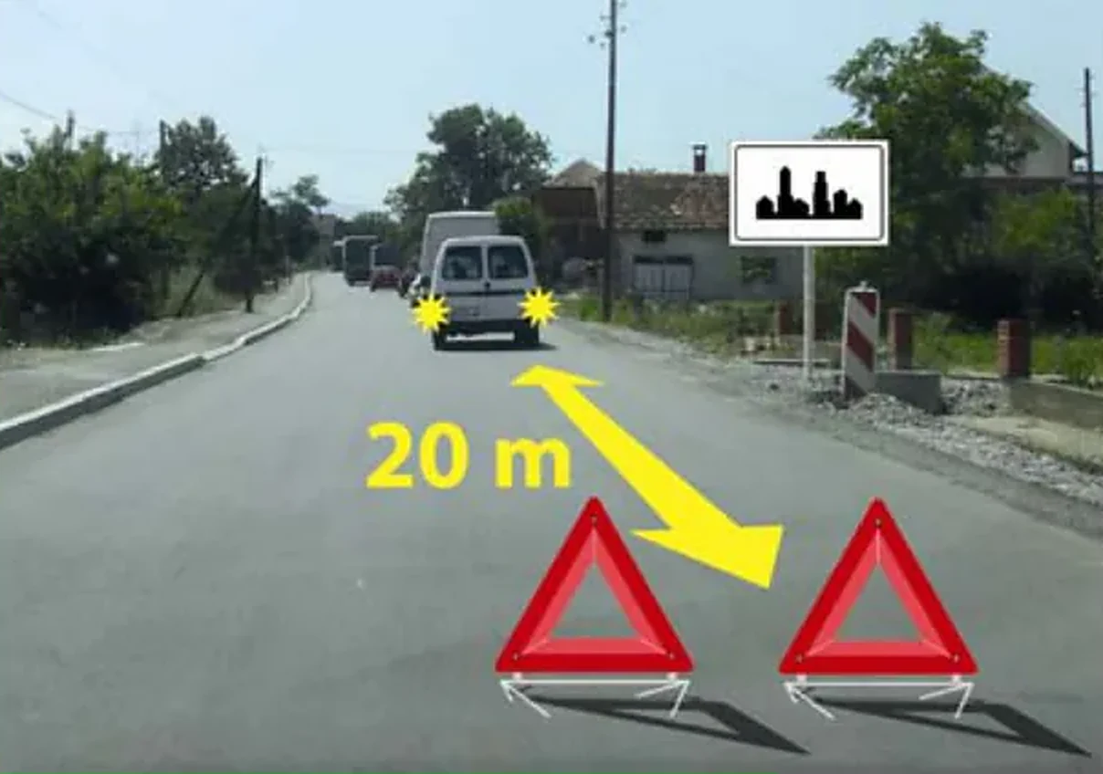 У ситуацији приказаној на слици колона заустављених моторних возила на путу у насељу:
