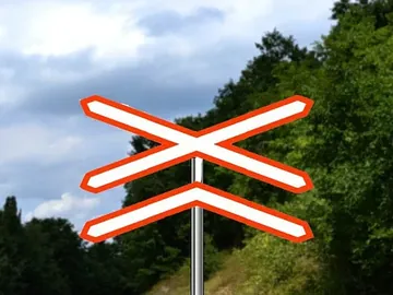 mesto na kome put prelazi preko železničke pruge u nivou bez branika ili polubranika, sa dva ili više koloseka